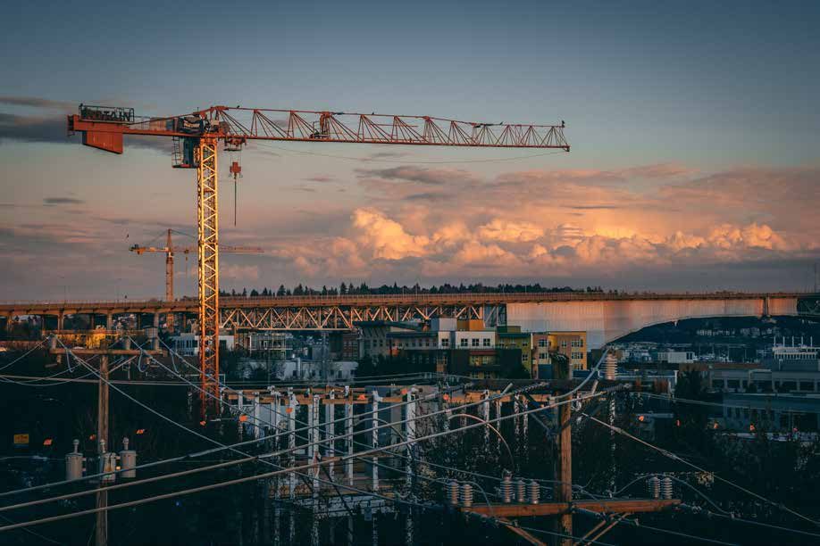 Tower crane at sunset over a construction site