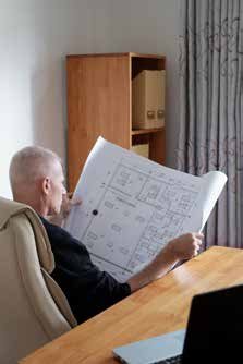 Engineer studying construction blueprints
